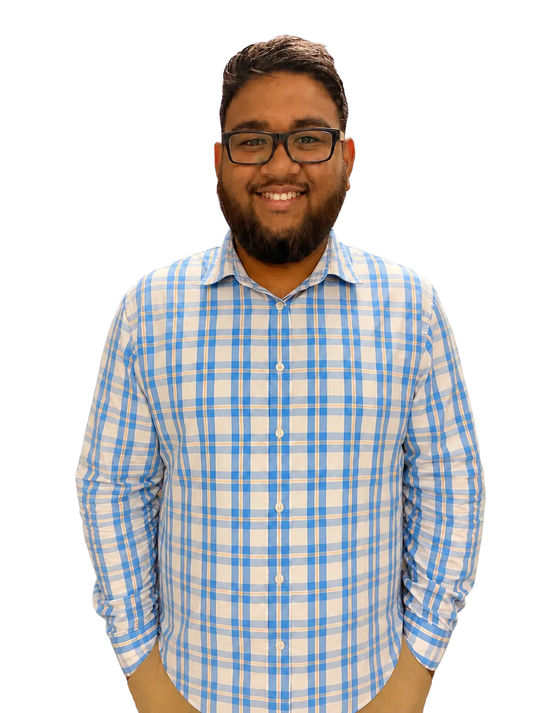 Ramphal Harrilal smiling in a blue plaid shirt